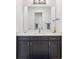 Bathroom vanity with a sink, mirror, and modern fixtures at 3607 Hidden River Ln, Tavares, FL 32778