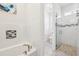 Well-lit bathroom with walk-in shower, mosaic tile accents, and modern fixtures at 3607 Hidden River Ln, Tavares, FL 32778