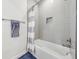 Modern bathroom with soaking tub and tile surround at 3607 Hidden River Ln, Tavares, FL 32778