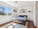 Bedroom featuring hardwood floors, a ceiling fan, and an open backyard view at 3607 Hidden River Ln, Tavares, FL 32778
