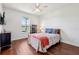 Charming bedroom with hardwood floors, abundant natural light, and stylish furnishings at 3607 Hidden River Ln, Tavares, FL 32778