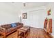 Comfortable bedroom with hardwood floors, a sofa, and a large closet at 3607 Hidden River Ln, Tavares, FL 32778