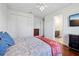 Bright bedroom with hardwood floors, ceiling fan and attached bathroom at 3607 Hidden River Ln, Tavares, FL 32778