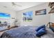 Bedroom featuring hardwood floors, a ceiling fan, and a scenic backyard view at 3607 Hidden River Ln, Tavares, FL 32778