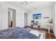 Well-lit bedroom with hardwood floors, ceiling fan and modern decor at 3607 Hidden River Ln, Tavares, FL 32778