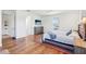 Bright and spacious bedroom with wood floors and a modern TV mounted on the wall at 3607 Hidden River Ln, Tavares, FL 32778
