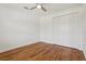 Empty bedroom featuring hardwood floors, a ceiling fan, and a closet with double doors at 3607 Hidden River Ln, Tavares, FL 32778