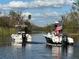 Two boats heading down waterway in Florida at 3607 Hidden River Ln, Tavares, FL 32778