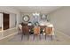 Bright dining area with table and accent wall, creating a comfortable space for gatherings at 3607 Hidden River Ln, Tavares, FL 32778