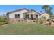 Lovely home featuring a well-kept lawn and inviting facade with a mix of materials at 3607 Hidden River Ln, Tavares, FL 32778