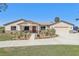 Charming single-story home with a well-manicured lawn, a two-car garage, and lovely landscaping at 3607 Hidden River Ln, Tavares, FL 32778