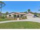 Attractive single-story home with a well-manicured lawn, two-car garage, and serene landscaping at 3607 Hidden River Ln, Tavares, FL 32778