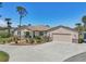 Charming single-story home with a landscaped front yard, two-car garage, and inviting entryway at 3607 Hidden River Ln, Tavares, FL 32778