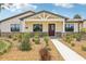 Beautiful home with stone accents, manicured landscaping, and a welcoming entrance at 3607 Hidden River Ln, Tavares, FL 32778