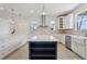 Gourmet kitchen features a large island, custom cabinetry, and stainless steel appliances at 3607 Hidden River Ln, Tavares, FL 32778