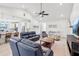 The bright living room features vaulted ceilings and opens to the kitchen and dining areas at 3607 Hidden River Ln, Tavares, FL 32778