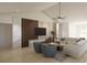Spacious living room featuring a modern TV wall, comfortable seating, and stylish decor at 3607 Hidden River Ln, Tavares, FL 32778