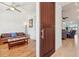 View of a bedroom and living room with hardwood floors from the entryway at 3607 Hidden River Ln, Tavares, FL 32778