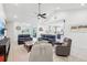 The spacious living room features vaulted ceilings and opens to the kitchen at 3607 Hidden River Ln, Tavares, FL 32778