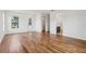 Bright, open living area with hardwood floors and neutral walls leading to walk-in closet and bathroom at 3607 Hidden River Ln, Tavares, FL 32778