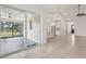 Bright living room with tile flooring, open to kitchen, and sliding door to Florida room at 3607 Hidden River Ln, Tavares, FL 32778