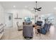 This bright and airy living room features vaulted ceilings, recessed lighting and neutral paint at 3607 Hidden River Ln, Tavares, FL 32778