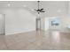 Spacious living room with high ceilings and neutral tile flooring at 3607 Hidden River Ln, Tavares, FL 32778