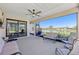 Relaxing covered patio overlooking a tranquil pond, perfect for outdoor enjoyment at 3607 Hidden River Ln, Tavares, FL 32778