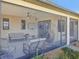 Relaxing screened porch with seating, ceiling fan, and view of the backyard at 3607 Hidden River Ln, Tavares, FL 32778