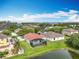 Aerial view of home with a screened-in pool, expansive backyard, and scenic pond at 3709 Cedar Hammock Trl, St Cloud, FL 34772