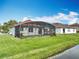 Spacious backyard with a screened-in pool and scenic pond view at 3709 Cedar Hammock Trl, St Cloud, FL 34772