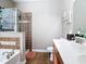 Bathroom featuring a dark wood vanity, tiled floors, and a shower/tub combo at 3709 Cedar Hammock Trl, St Cloud, FL 34772