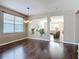 Cozy dining room featuring hardwood floors, bright neutral paint, and natural light at 3709 Cedar Hammock Trl, St Cloud, FL 34772