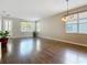 Bright living room featuring hardwood floors, a chandelier, neutral paint, and lots of natural light at 3709 Cedar Hammock Trl, St Cloud, FL 34772