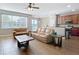 Spacious living room that opens to the kitchen featuring tile floors and comfortable seating at 3709 Cedar Hammock Trl, St Cloud, FL 34772
