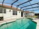 Inviting screened-in pool area with outdoor seating, perfect for relaxing and entertaining at 3709 Cedar Hammock Trl, St Cloud, FL 34772