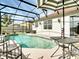 View of screened in pool and surrounding patio at 3709 Cedar Hammock Trl, St Cloud, FL 34772