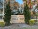Bella Vista community sign with decorative stone and landscaping at 401 Fountainhead Cir # 155, Kissimmee, FL 34741
