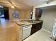 Kitchen features stainless steel sink, granite countertops and white appliances at 401 Fountainhead Cir # 155, Kissimmee, FL 34741