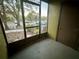 Enclosed outdoor patio area with view of parking and landscaping at 401 Fountainhead Cir # 155, Kissimmee, FL 34741