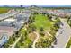 A serene neighborhood boasts a lush central park perfect for recreation and community gatherings at 7059 Nemours Pkwy, Orlando, FL 32827