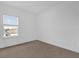 A bedroom with carpet and a window that provides natural light at 7059 Nemours Pkwy, Orlando, FL 32827