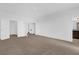 Bedroom has plush carpet, multiple closets, and access to the ensuite bathroom at 7059 Nemours Pkwy, Orlando, FL 32827
