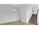 Dining area features a chandelier and staircase at 7059 Nemours Pkwy, Orlando, FL 32827