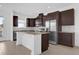 Modern kitchen with stainless steel appliances, granite countertops, and ample cabinet space at 7059 Nemours Pkwy, Orlando, FL 32827