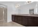 The main bathroom features double sinks and a glass enclosed shower at 7059 Nemours Pkwy, Orlando, FL 32827