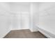 Walk-in closet featuring wire shelving and carpet at 7059 Nemours Pkwy, Orlando, FL 32827