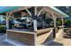 Charming poolside bar area, perfect for enjoying refreshing drinks and socializing at 7673 Heritage Crossing Way # 301, Reunion, FL 34747