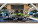 Outdoor bar with a surfboard drink menu, offering a variety of frozen, canned and draft beverages at 7673 Heritage Crossing Way # 301, Reunion, FL 34747