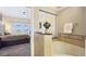Bathroom connecting to main bedroom with large soaking tub and granite countertops at 7673 Heritage Crossing Way # 301, Reunion, FL 34747